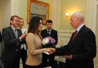 Prime Minister Mykola Azarov congratulating Ukrainian Eurovision 2013 singer Zlata Ognevich. Photograph ForUM