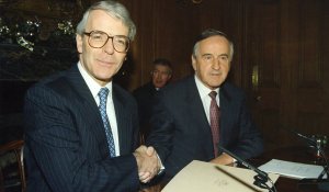 L TO R. British Prime Minister John Major shakes hands with Taoiseach and Fianna Fail leader Albert Reynolds on the Joint Declartion at a press conference in Downing St. In the backgorund is press officer Sean Duignan. 15/12/1993 Pic Eamonn Farrell/Photocall Ireland