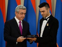 Andre receiving Armenia Artist of Honour from President Serzh Sargsyan. Photo Andre Mgt